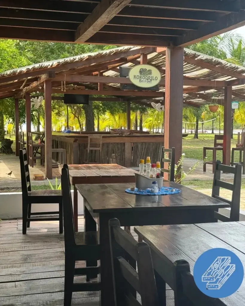 Hardwood tables and bar inside the open-air Kokodrilo Bar & Grill