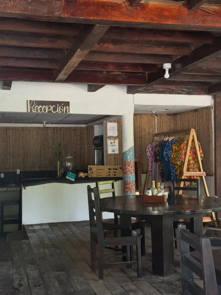 Reception desk and dining area with local crafts for sale