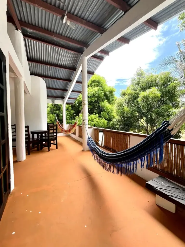 Sea room balcony with hammocks overlooking the trees