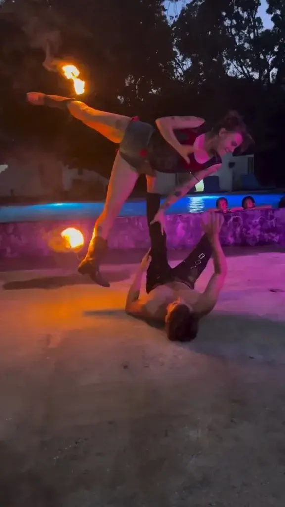 Fire acrobatics show by the pool on a Saturday night