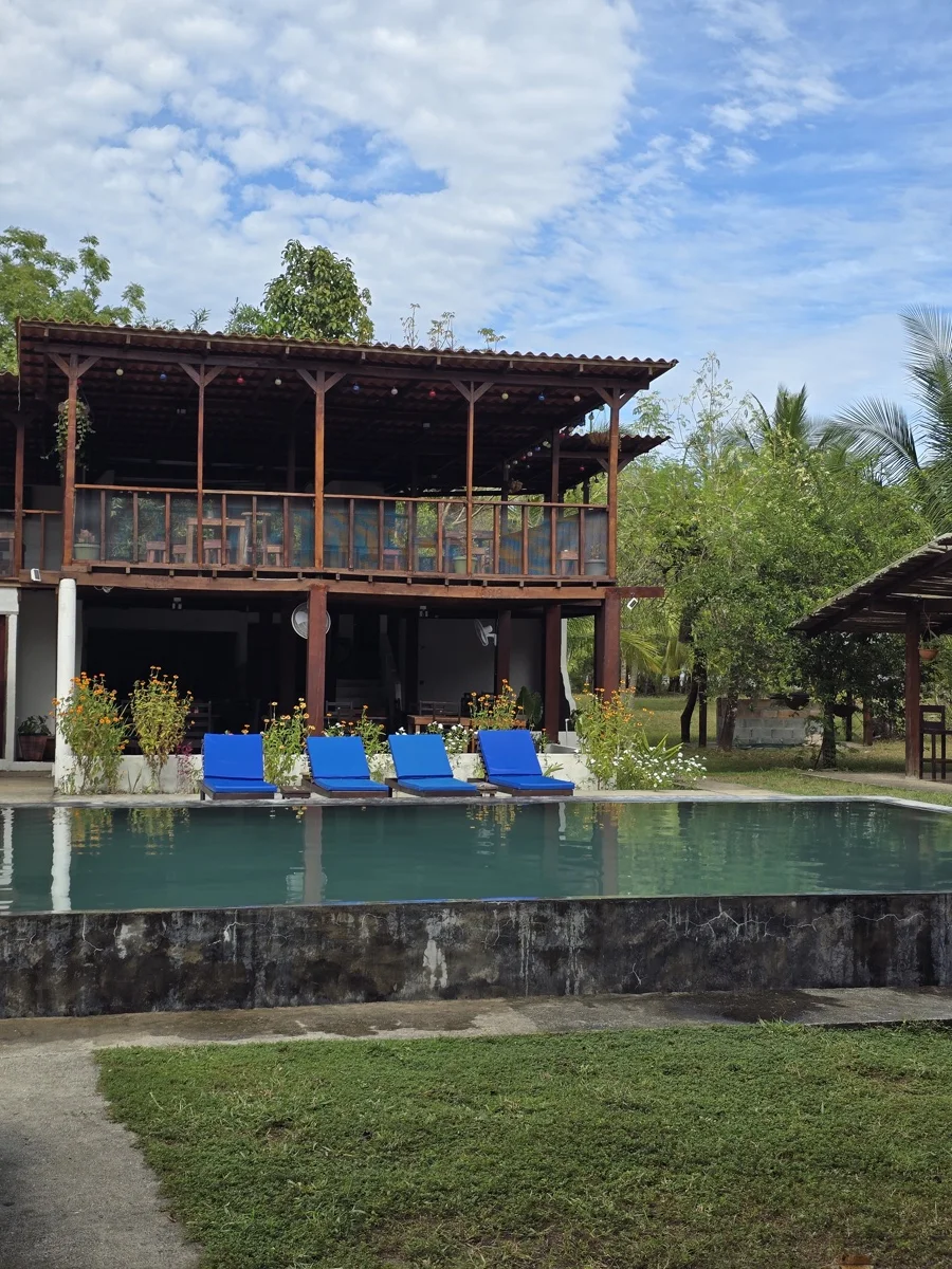 Outside view of Hotel Hibiscus Garden and its swimming pool