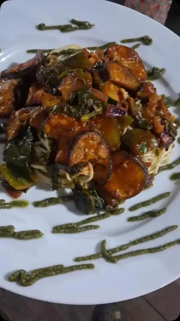 Plated shrimp dish with sautéed vegetables